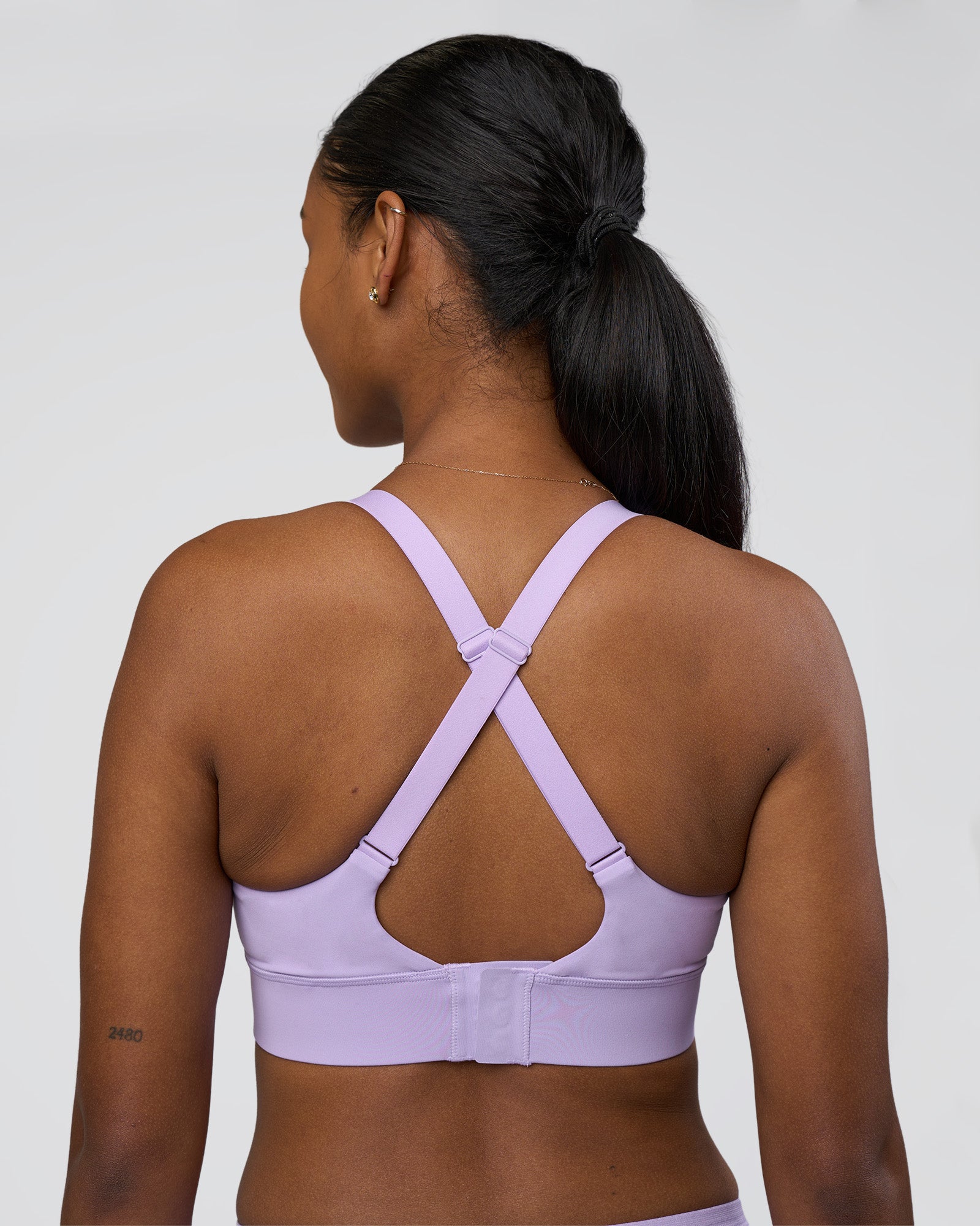 Woman wearing Accelerate Sports Bra - Pale Lilac | Model:Rica | Size:S