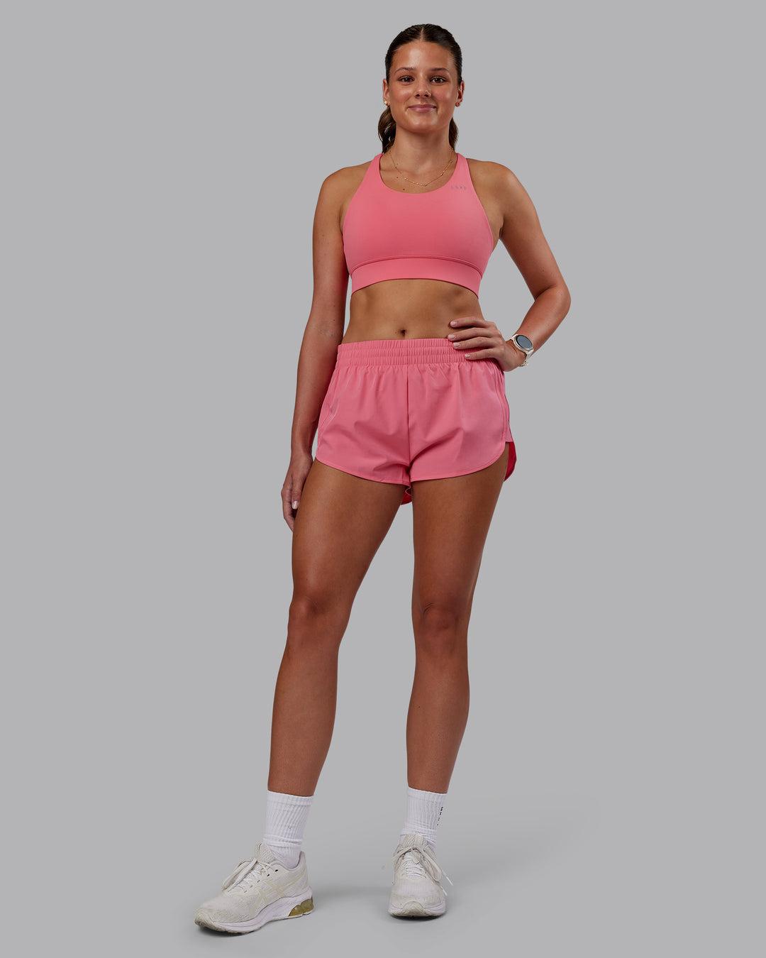 Woman wearing Accelerate Sports Bra - Pink Lemonade | Model:Phoebe | Size:S