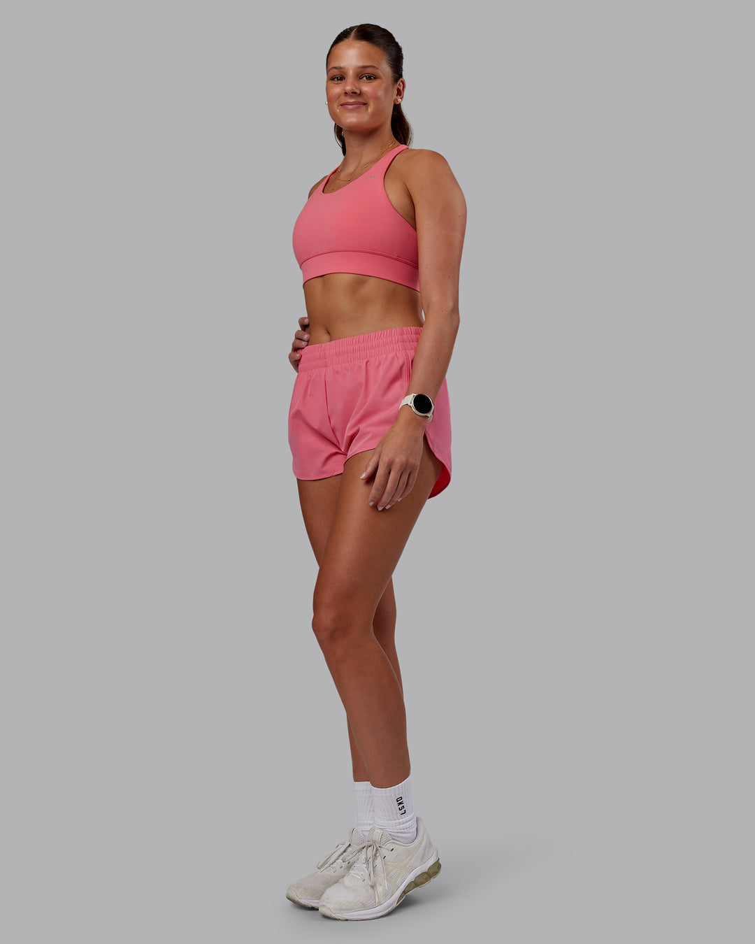 Woman wearing Accelerate Sports Bra - Pink Lemonade | Model:Phoebe | Size:S