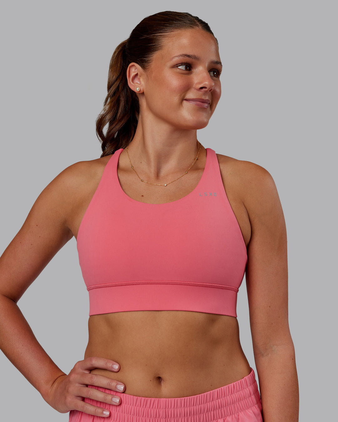 Woman wearing Accelerate Sports Bra - Pink Lemonade | Model:Phoebe | Size:S