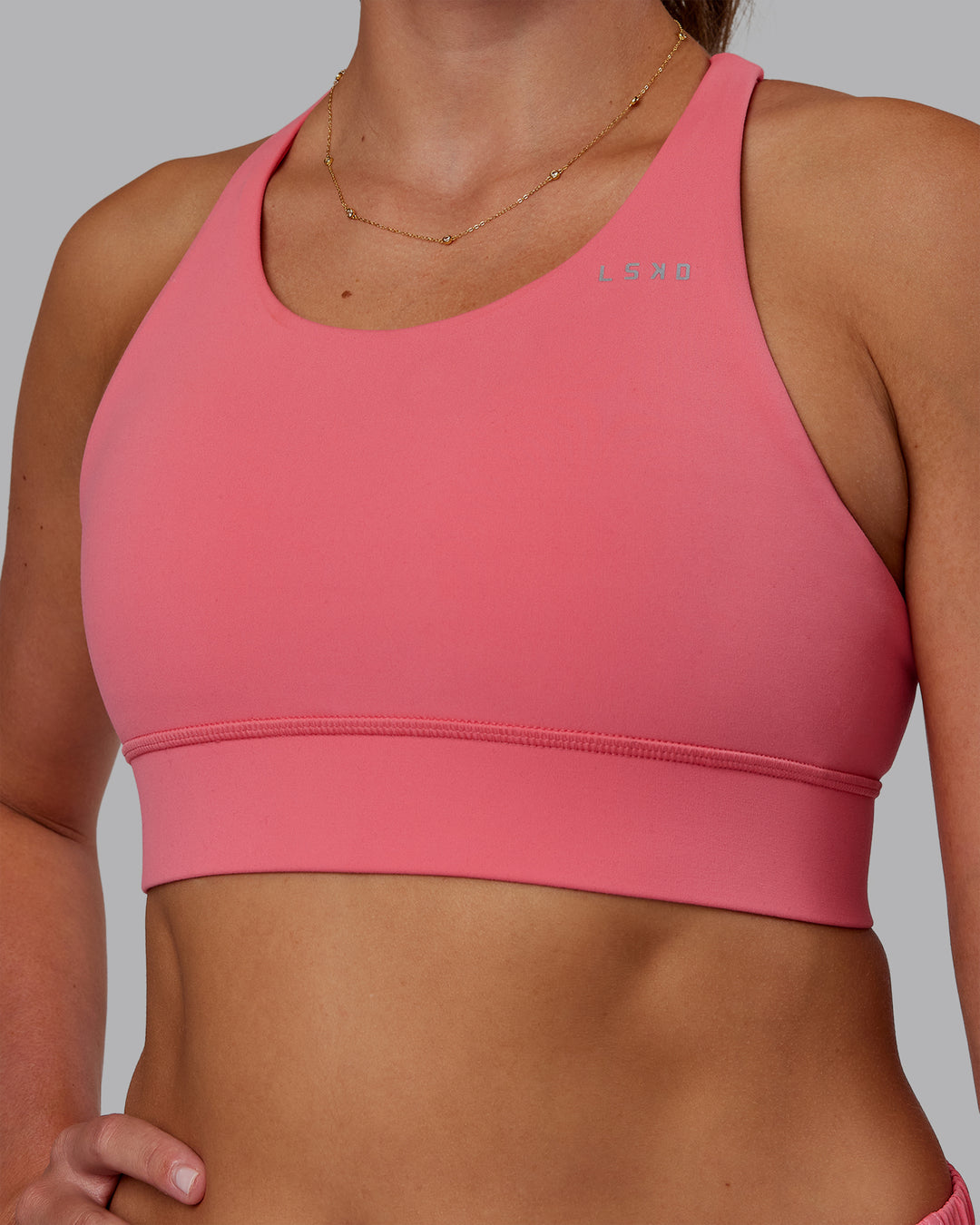 Woman wearing Accelerate Sports Bra - Pink Lemonade | Model:Phoebe | Size:S