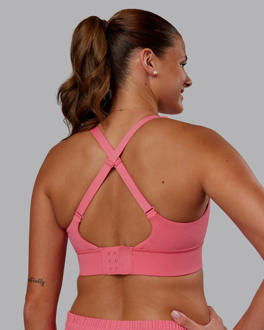 Woman wearing Accelerate Sports Bra - Pink Lemonade | Model:Phoebe | Size:S