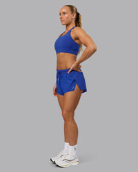 Woman wearing Accelerate Sports Bra in Power Cobalt | Size:S