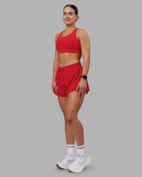 Woman wearing Accelerate Sports Bra - Scarlet | Model:Keisha | Size:S