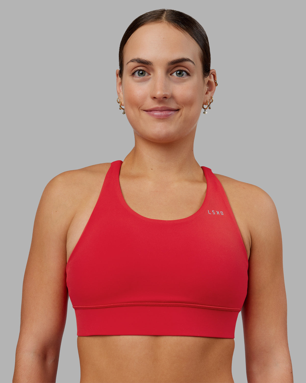 Woman wearing Accelerate Sports Bra - Scarlet | Model:Keisha | Size:S