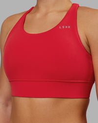 Woman wearing Accelerate Sports Bra - Scarlet | Set:true | Angle:closeup | Model:Keisha | Size:S