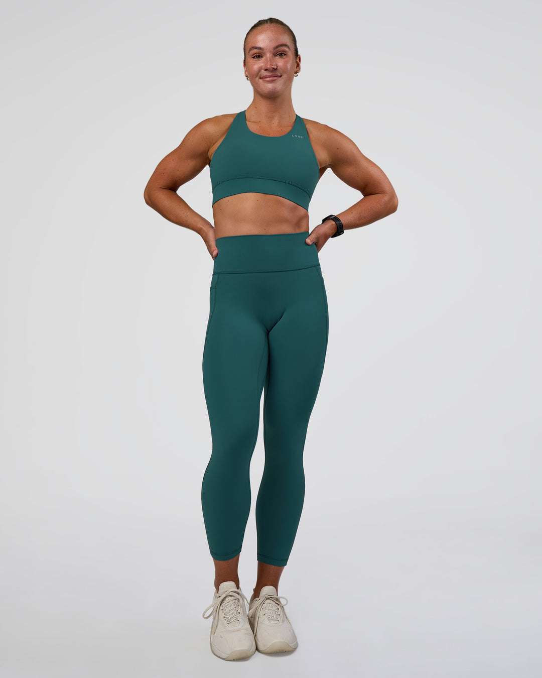 Woman wearing Accelerate Sports Bra - Transformative Teal | Model:Sav | Size:S