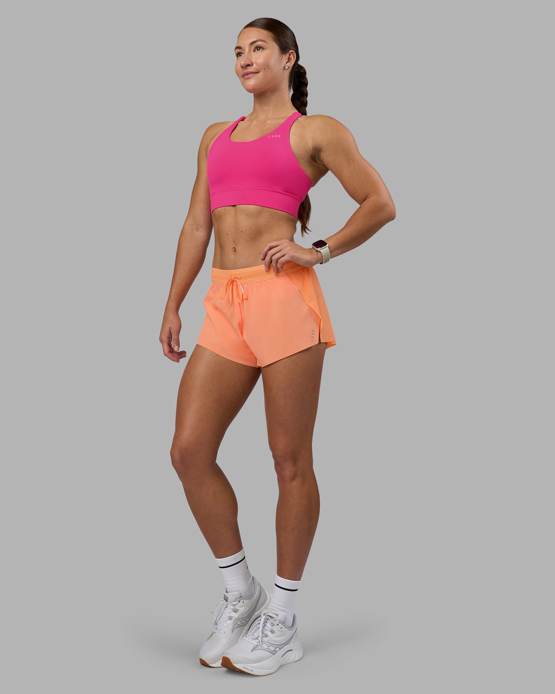 Woman wearing Accelerate Sports Bra - Ultra Pink | Model:Hannah | Size:S