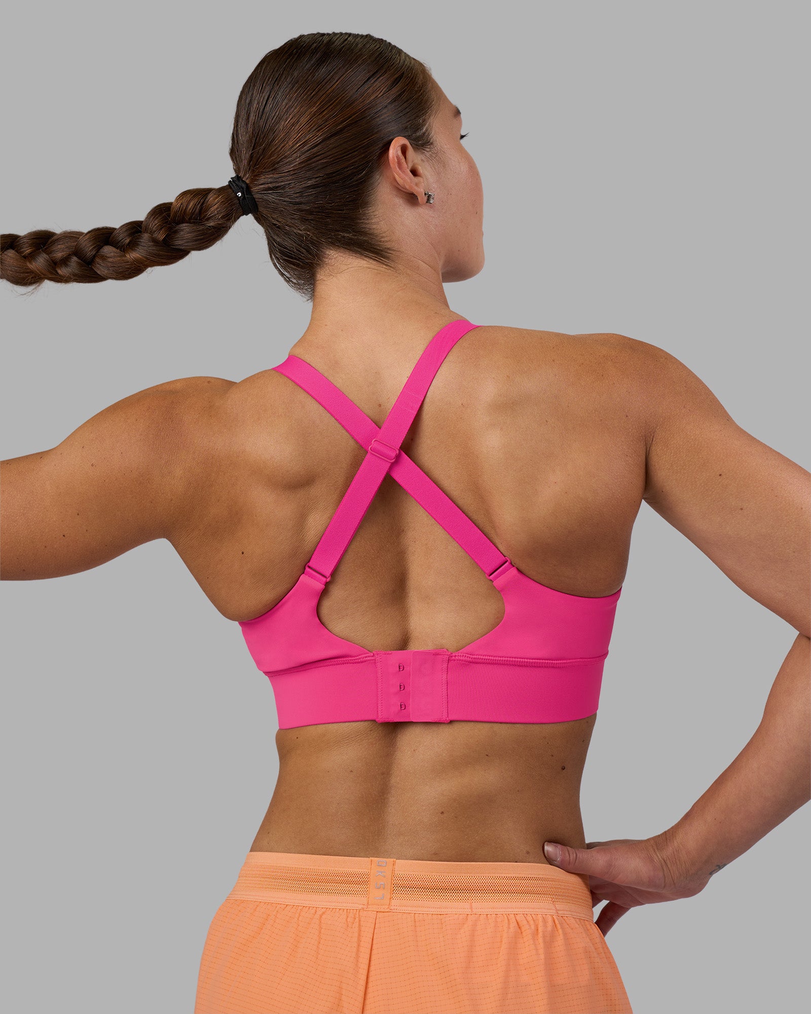 Woman wearing Accelerate Sports Bra - Ultra Pink | Model:Hannah | Size:S