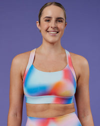 Woman wearing Advance Sports Bra - Rainbow Shade | Model:Mon | Size:M