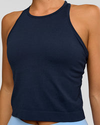 Woman wearing AeroFLX+ Seamless Flow Skimmer Tank - Future Navy/Future Navy | Model:Amity | Size:S