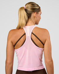 Woman wearing AeroFLX+ Seamless Flow Skimmer Tank - Marshmallow/Marshmallow | Model:Amity | Size:S