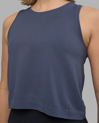 Woman wearing AeroFLX+ Seamless Skimmer Tank - Night Shadow/Night Shadow | Model:Halle | Size:S