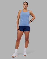 Woman wearing AeroFLX+ Seamless Tank - Cornflower Blue Marl | Model:Keisha | Size:S