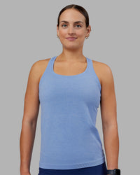 Woman wearing AeroFLX+ Seamless Tank - Cornflower Blue Marl | Model:Keisha | Size:S