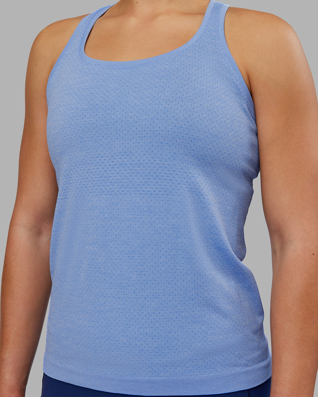 Woman wearing AeroFLX+ Seamless Tank - Cornflower Blue Marl | Model:Keisha | Size:S