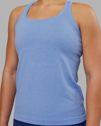 Woman wearing AeroFLX+ Seamless Tank - Cornflower Blue Marl | Model:Keisha | Size:S