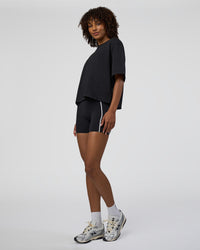 Woman wearing AfterDark ZeroCrease Cropped Tee - Black | Model:Tomi | Size:S
