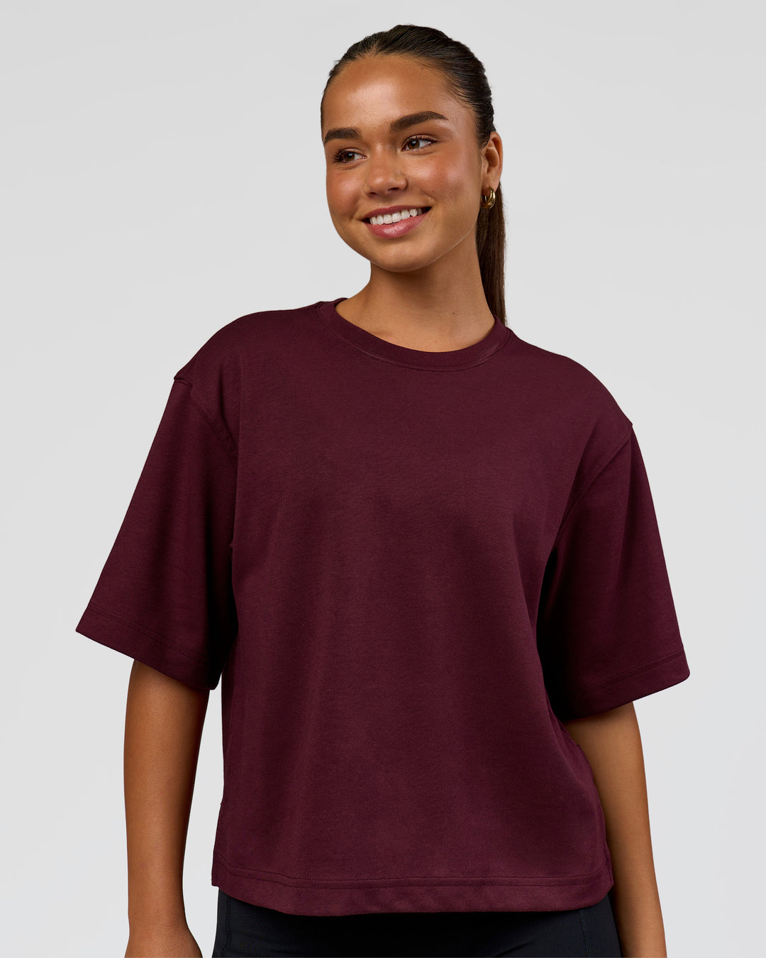 Woman wearing AfterDark ZeroCrease Cropped Tee - Cherry Lacquer | Model:Sophia | Size:S