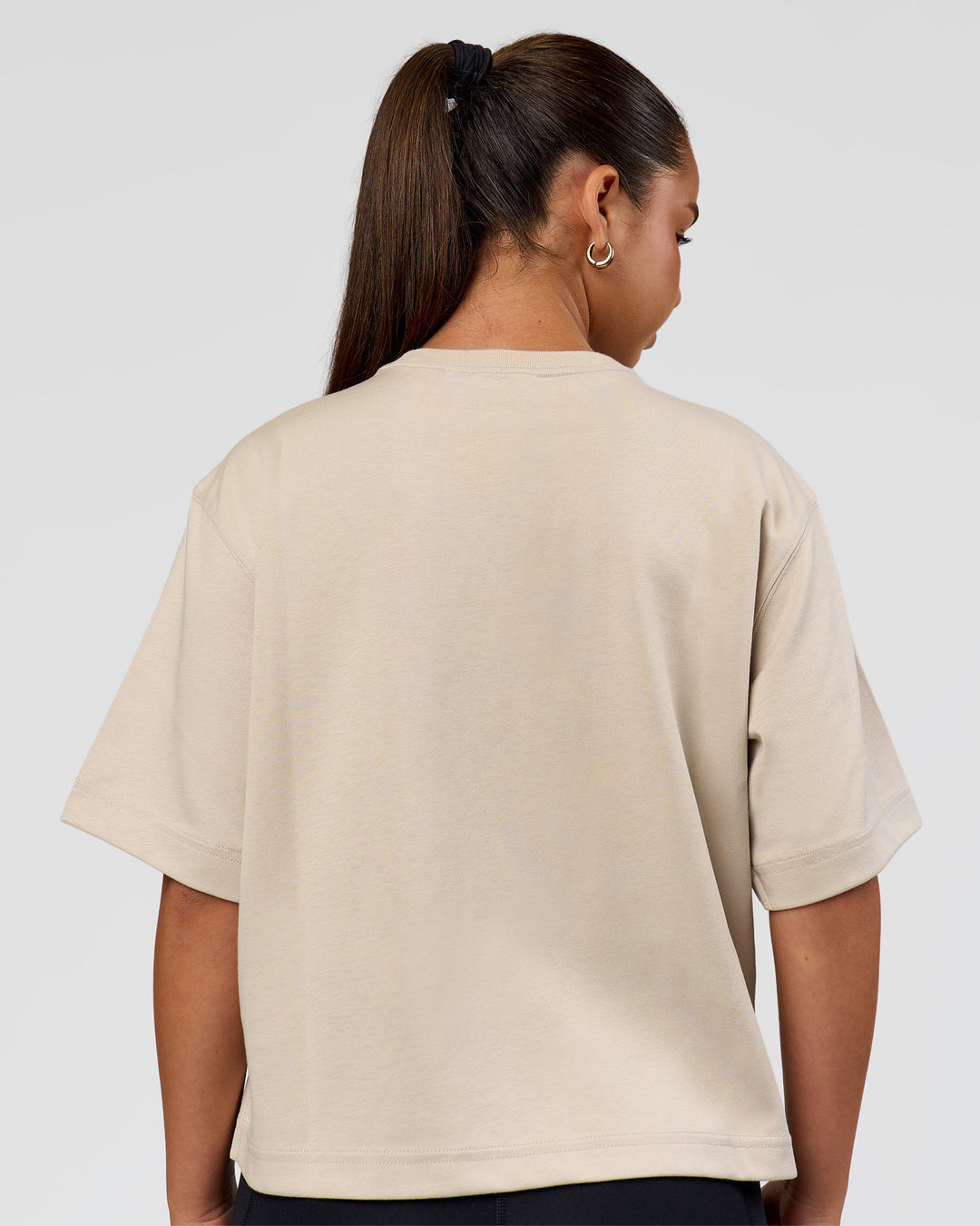 Woman wearing AfterDark ZeroCrease Cropped Tee - Shale Beige | Model:Sophia | Size:S