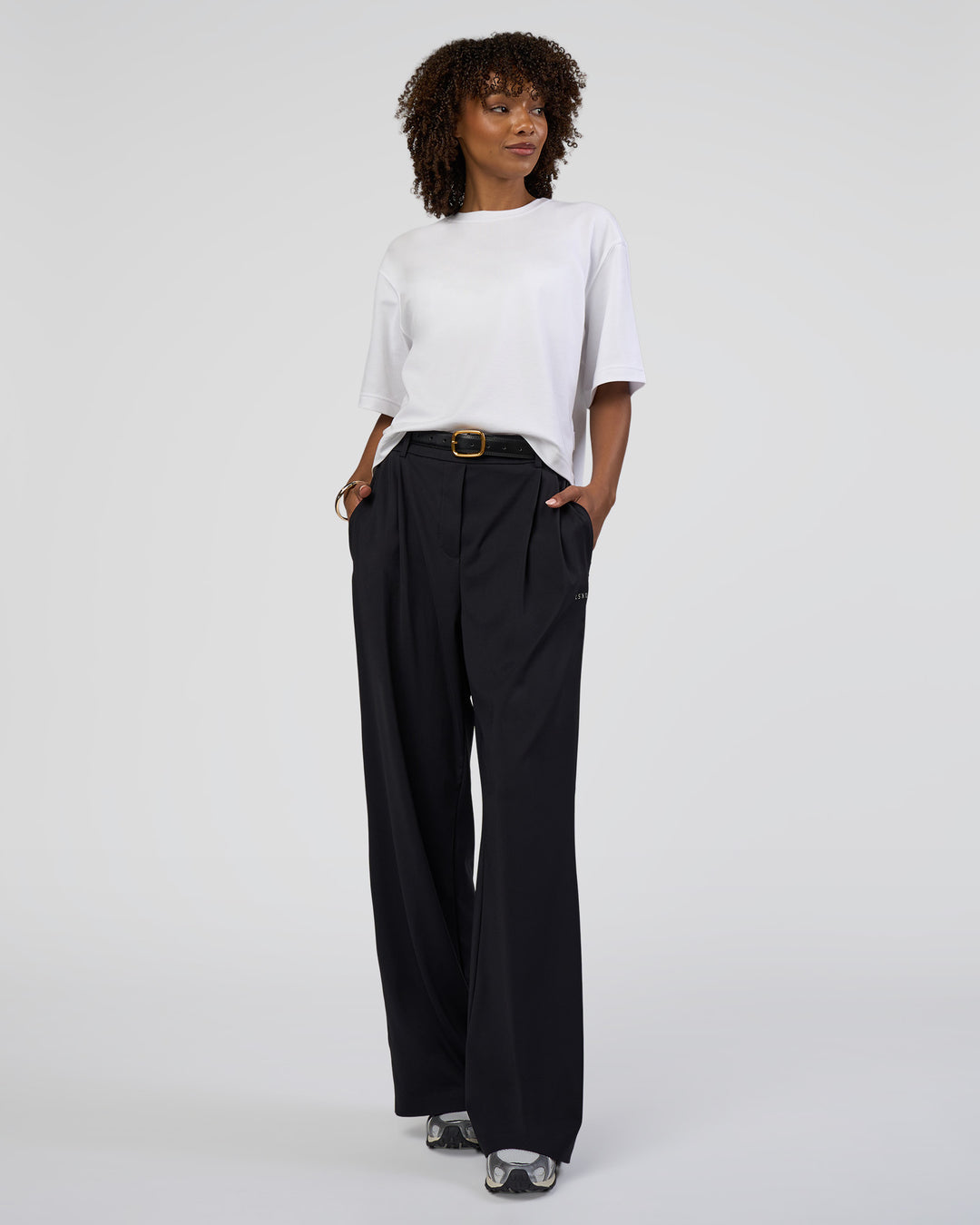 Woman wearing AfterDark ZeroCrease Cropped Tee - White | Model:Tomi | Size:S