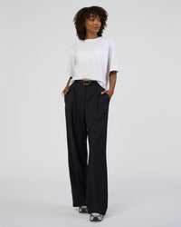 Woman wearing AfterDark ZeroCrease Cropped Tee - White | Model:Tomi | Size:S