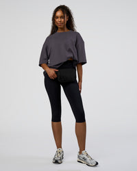 Woman wearing AfterDark ZeroCrease Oversized Tee - Dark Storm | Model:Jordan | Size:S