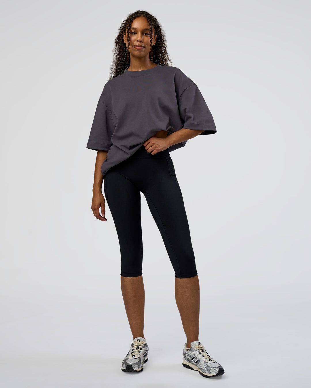 Woman wearing AfterDark ZeroCrease Oversized Tee - Dark Storm | Model:Jordan | Size:S