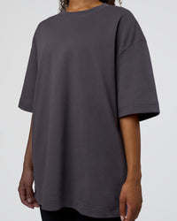 Woman wearing AfterDark ZeroCrease Oversized Tee - Dark Storm | Model:Jordan | Size:S
