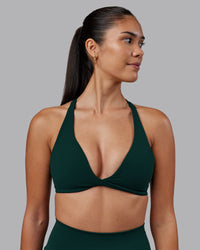 Woman wearing Agile Sports Bra - Dark Moss | Model:Rhiley | Size:S