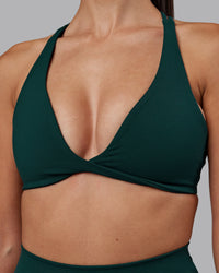 Woman wearing Agile Sports Bra - Dark Moss | Model:Rhiley | Size:S