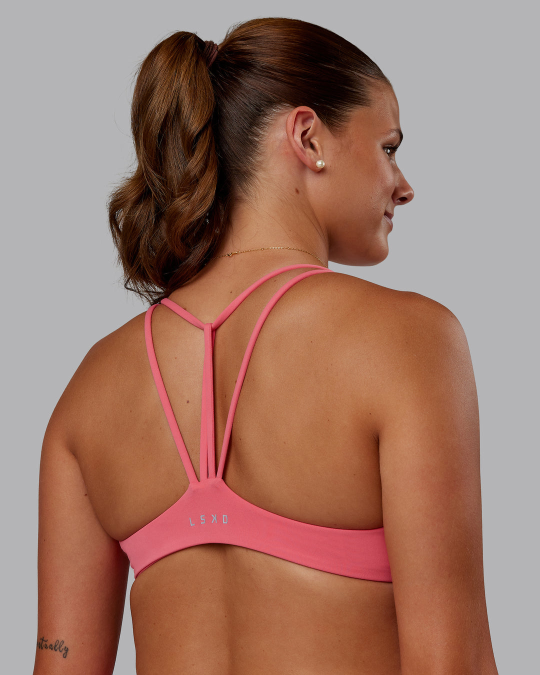 Woman wearing Agile Sports Bra - Pink Lemonade | Model:Phoebe | Size:S