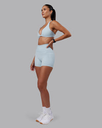 Woman wearing Agile Sports Bra - Skyride | Model:Rhiley | Size:S