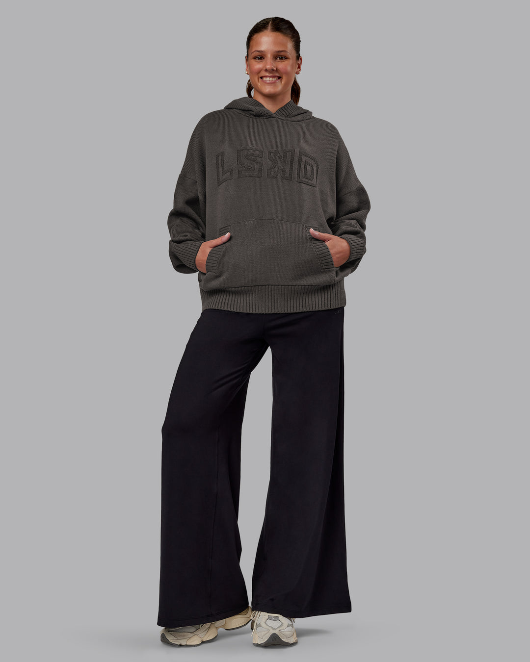 Woman wearing All Day Active Knitted Hoodie - Dark Storm | Model:Phoebe | Size:S