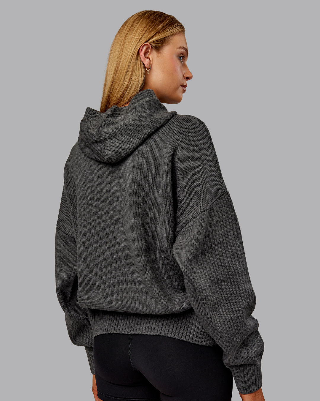 Woman wearing All Day Active Knitted Hoodie - Dark Storm | Model:Ella | Size:S