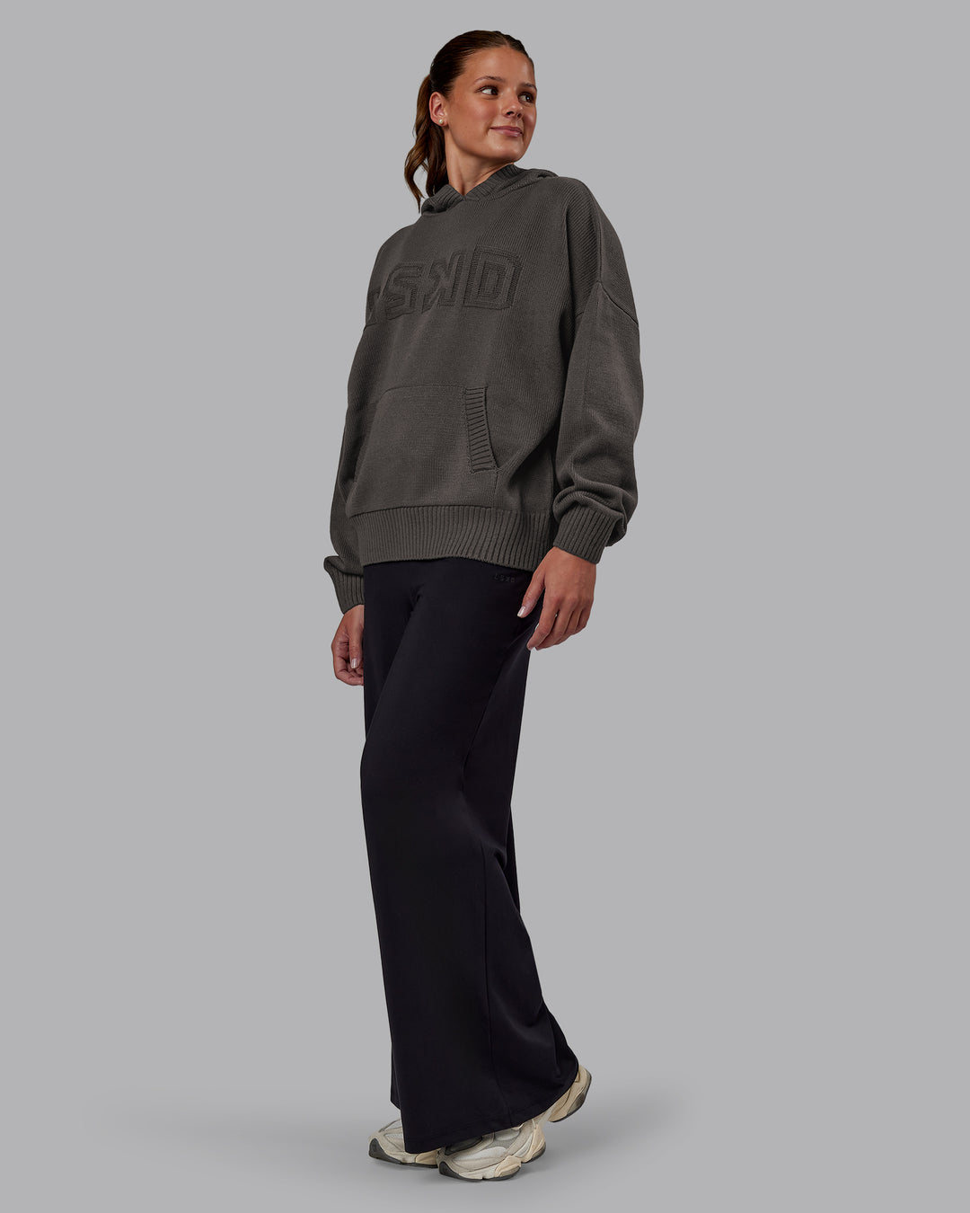 Woman wearing All Day Active Knitted Hoodie - Dark Storm | Model:Phoebe | Size:S