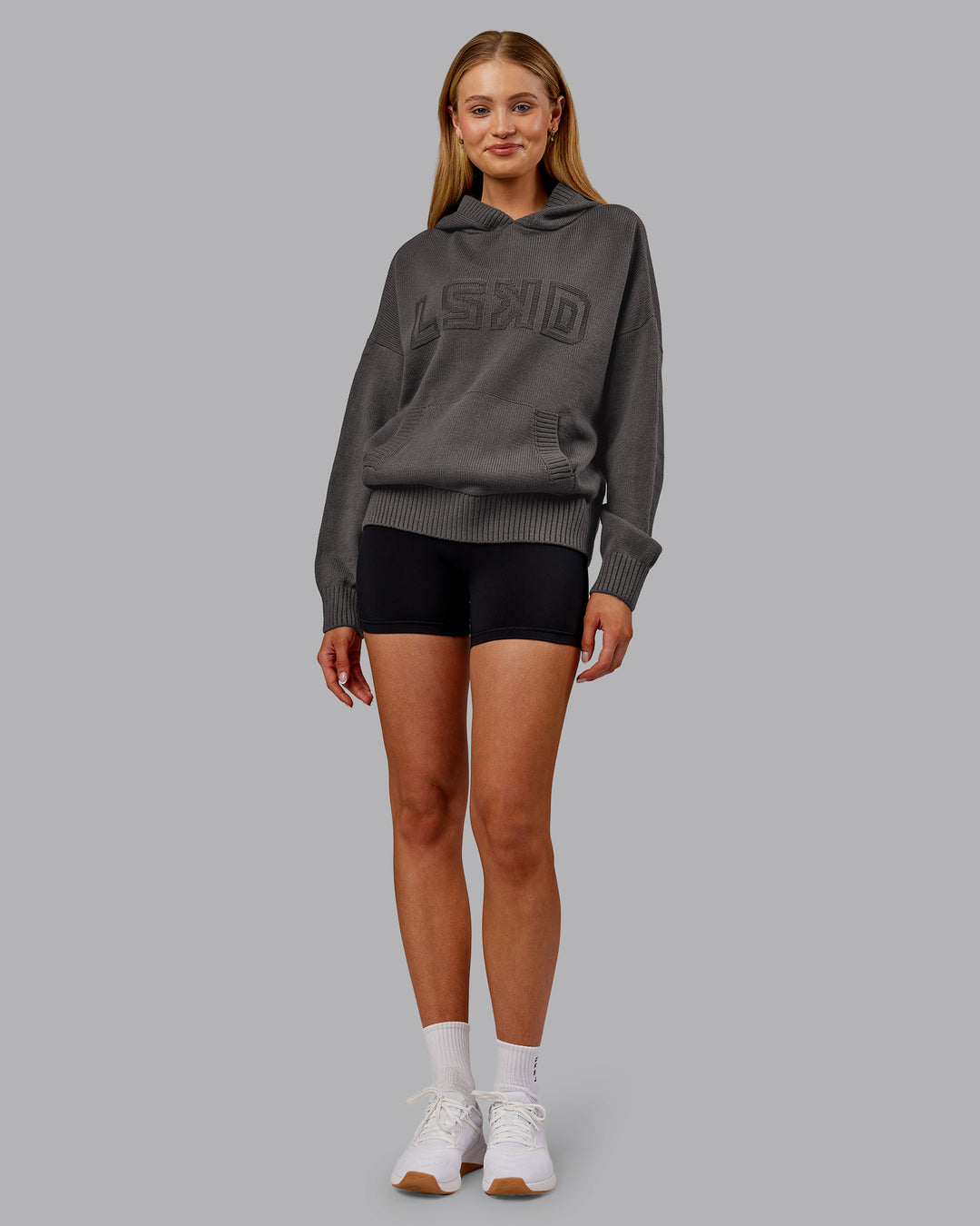 Woman wearing All Day Active Knitted Hoodie - Dark Storm | Model:Ella | Size:S