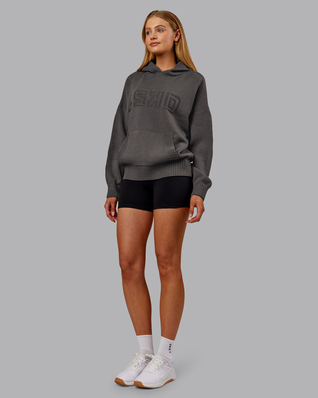 Woman wearing All Day Active Knitted Hoodie - Dark Storm | Model:Ella | Size:S