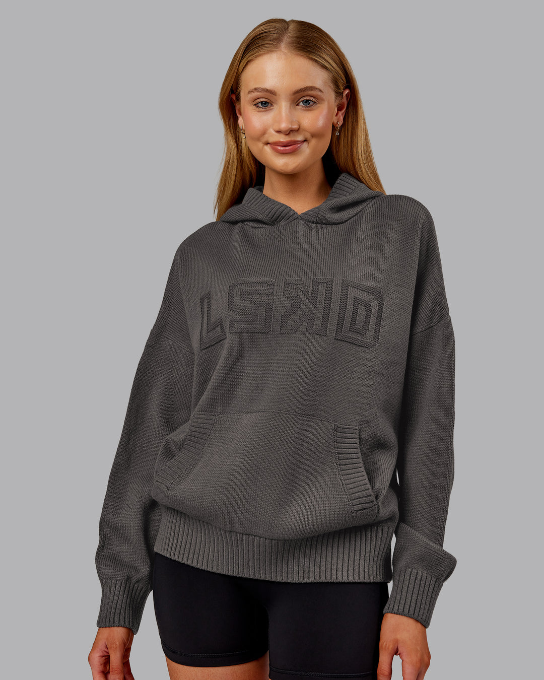 Woman wearing All Day Active Knitted Hoodie - Dark Storm | Model:Ella | Size:S