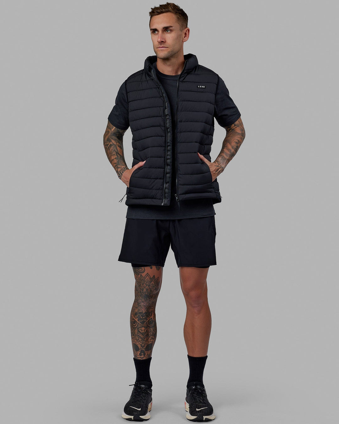 Man wearing All Day Puffer Vest - Black