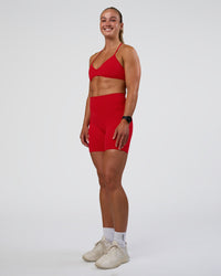 Woman wearing Ambience Sports Bra - Flame | Model:Sav | Size:S