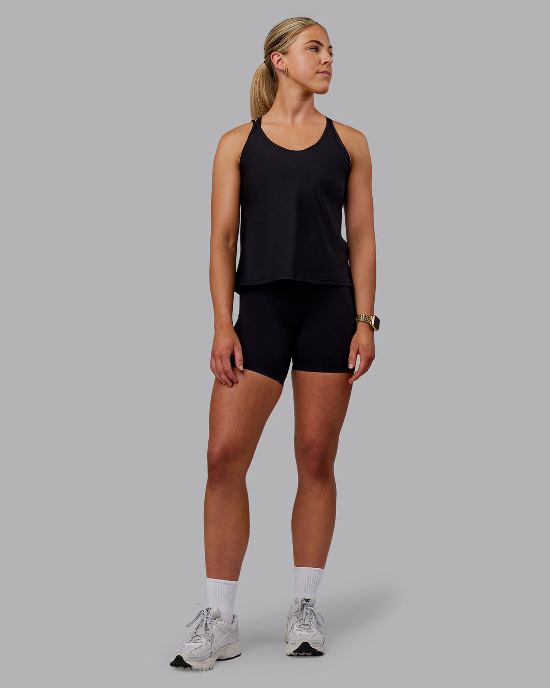 Woman wearing Apex Lightweight Performance Tank - Black