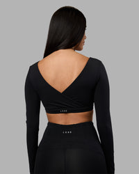 Woman wearing Aria Long Sleeve Sports Bra - Black | Model:Rhiley | Size:S