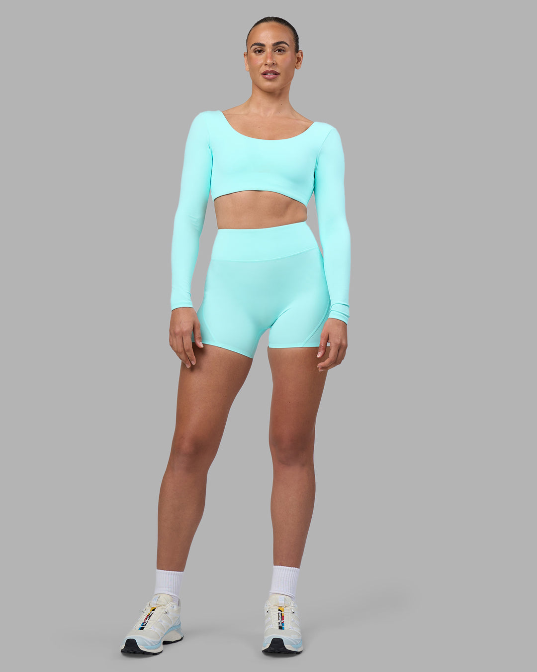 Woman wearing Aria Long Sleeve Sports Bra - Island Paradise | Model:Sophie | Size:S