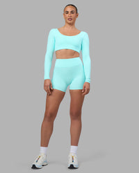 Woman wearing Aria Long Sleeve Sports Bra - Island Paradise | Model:Sophie | Size:S