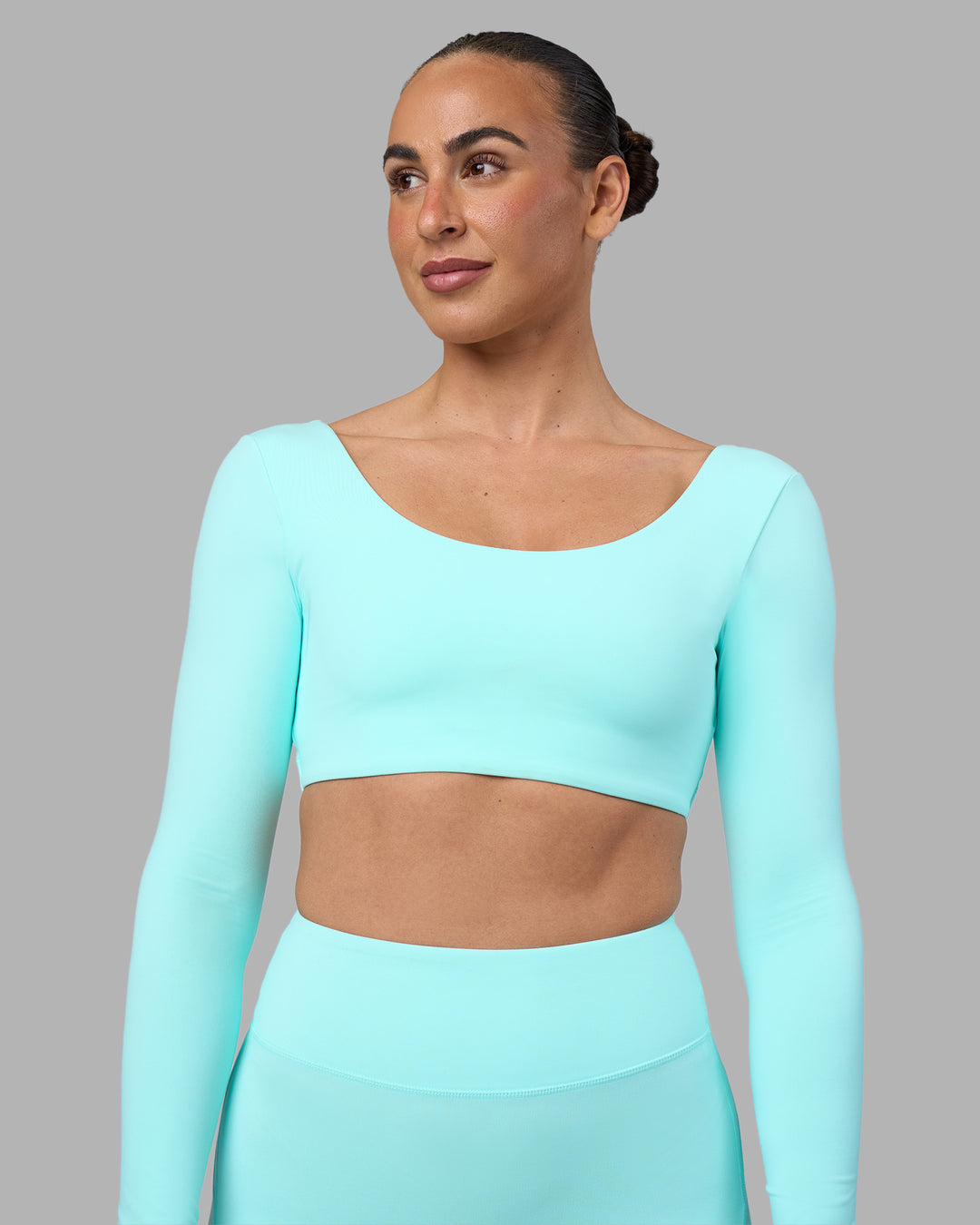 Woman wearing Aria Long Sleeve Sports Bra - Island Paradise | Model:Sophie | Size:S