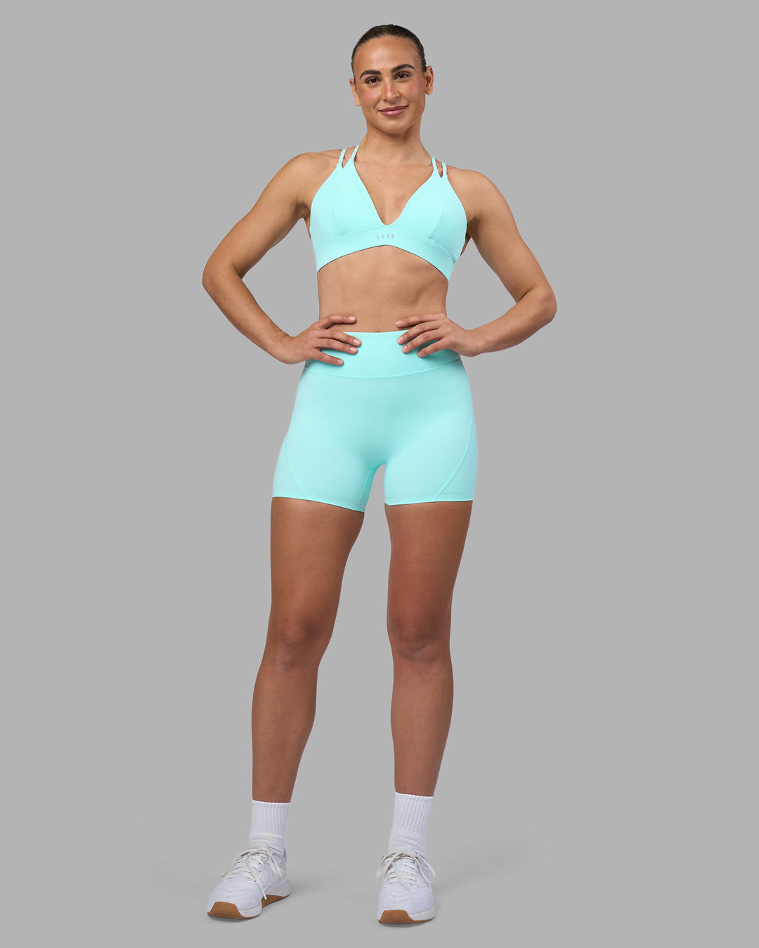 Woman wearing Aria Triangle Sports Bra - Island Paradise | Model:Sophie | Size:S