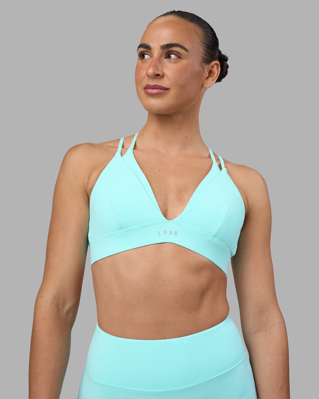 Woman wearing Aria Triangle Sports Bra - Island Paradise | Model:Sophie | Size:S