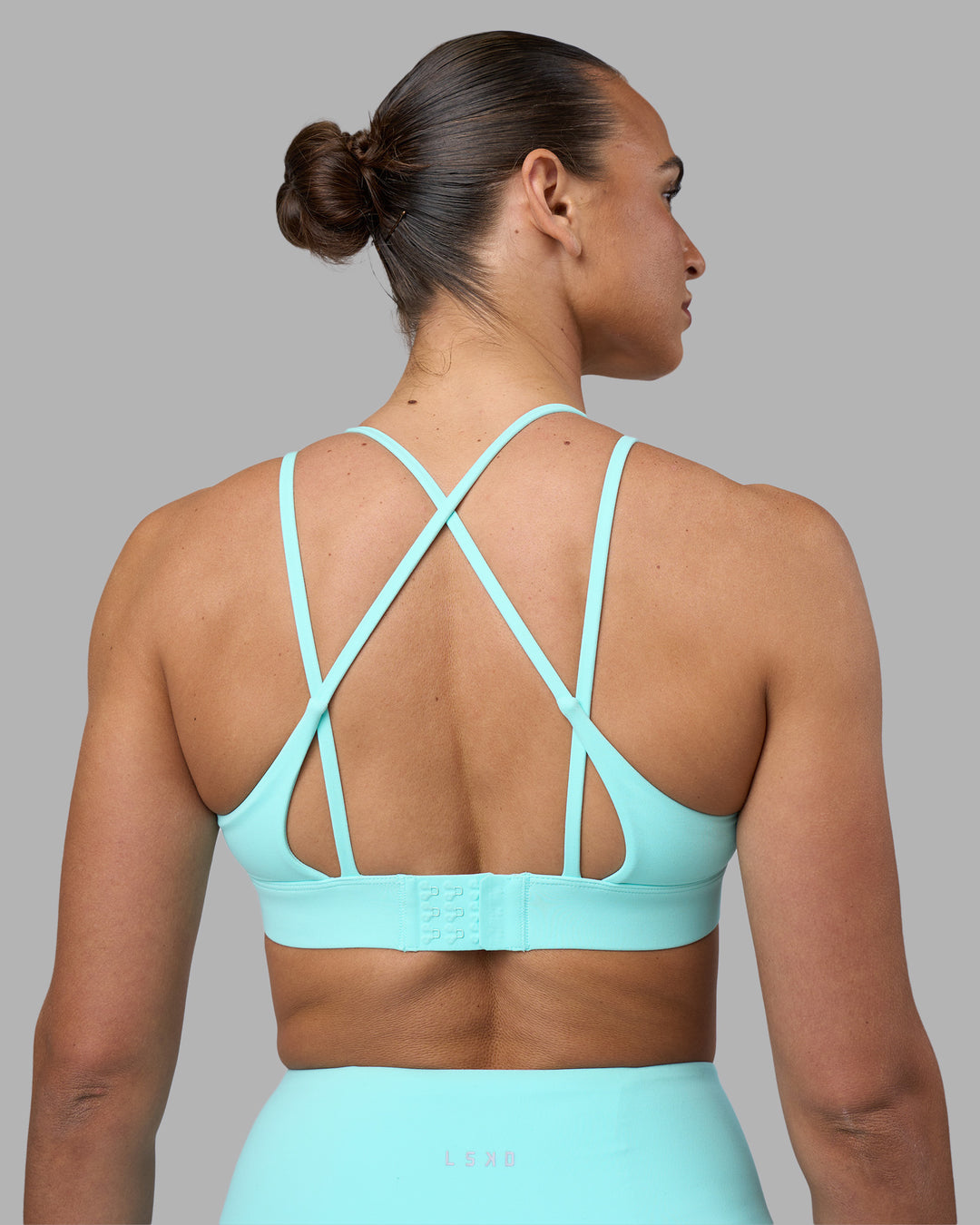 Woman wearing Aria Triangle Sports Bra - Island Paradise | Model:Sophie | Size:S