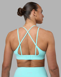 Woman wearing Aria Triangle Sports Bra - Island Paradise | Model:Sophie | Size:S
